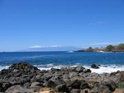 The faint mountainp in the distance is Maui.