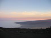 Clouds ending where they hit the volcano.