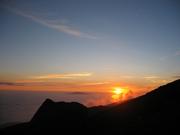 Setting sun, with Maui.