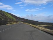 The road cut across a somewhat-recent lava flow.