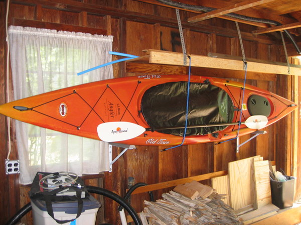 Kayak mounted to garage wall