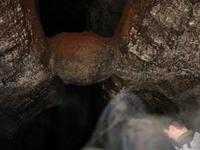 A rock wedged in the ceiling