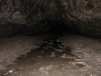 The end of this direction of the cave.  You could crawl down a bit further (it is only a couple of feet high at this point), but it should be a dead end.